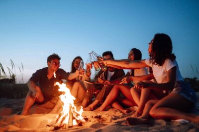 Freinds enjoying spring break . making cheers to their freindship
